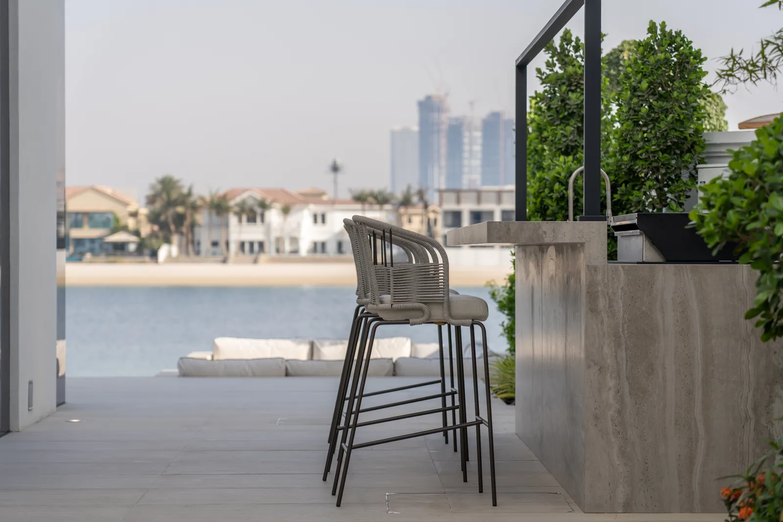 Bar seating on the terrace overlooking the water