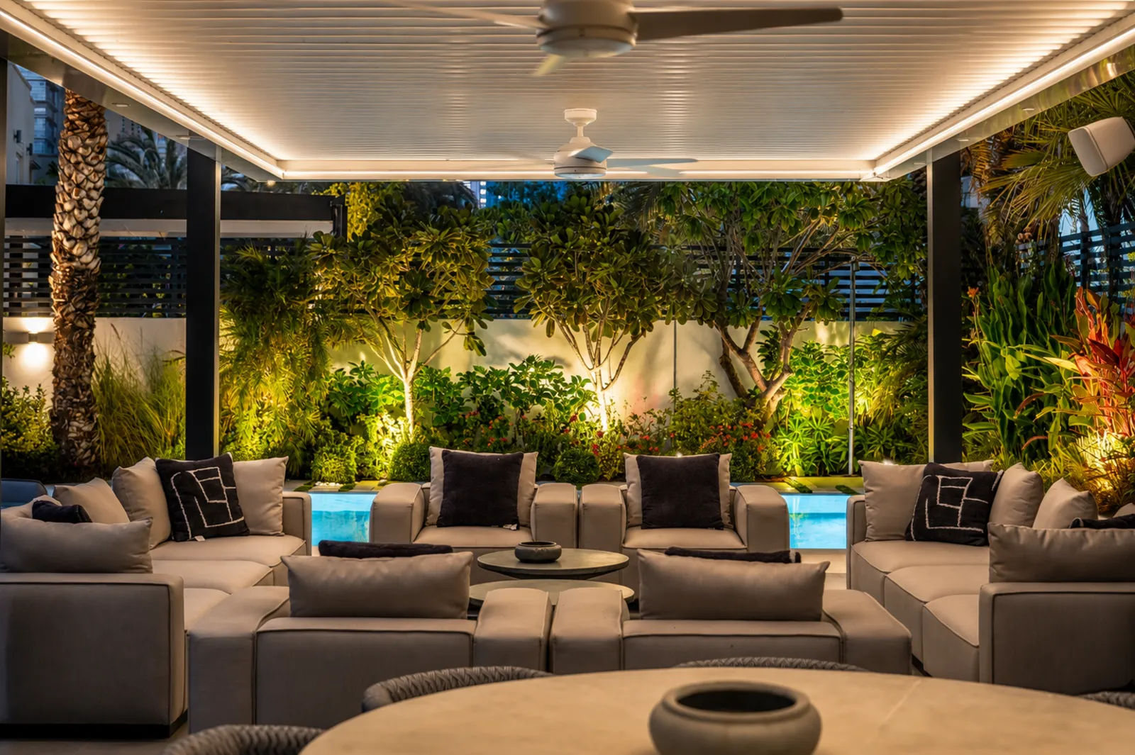 The sunken lounge lit from within at dusk