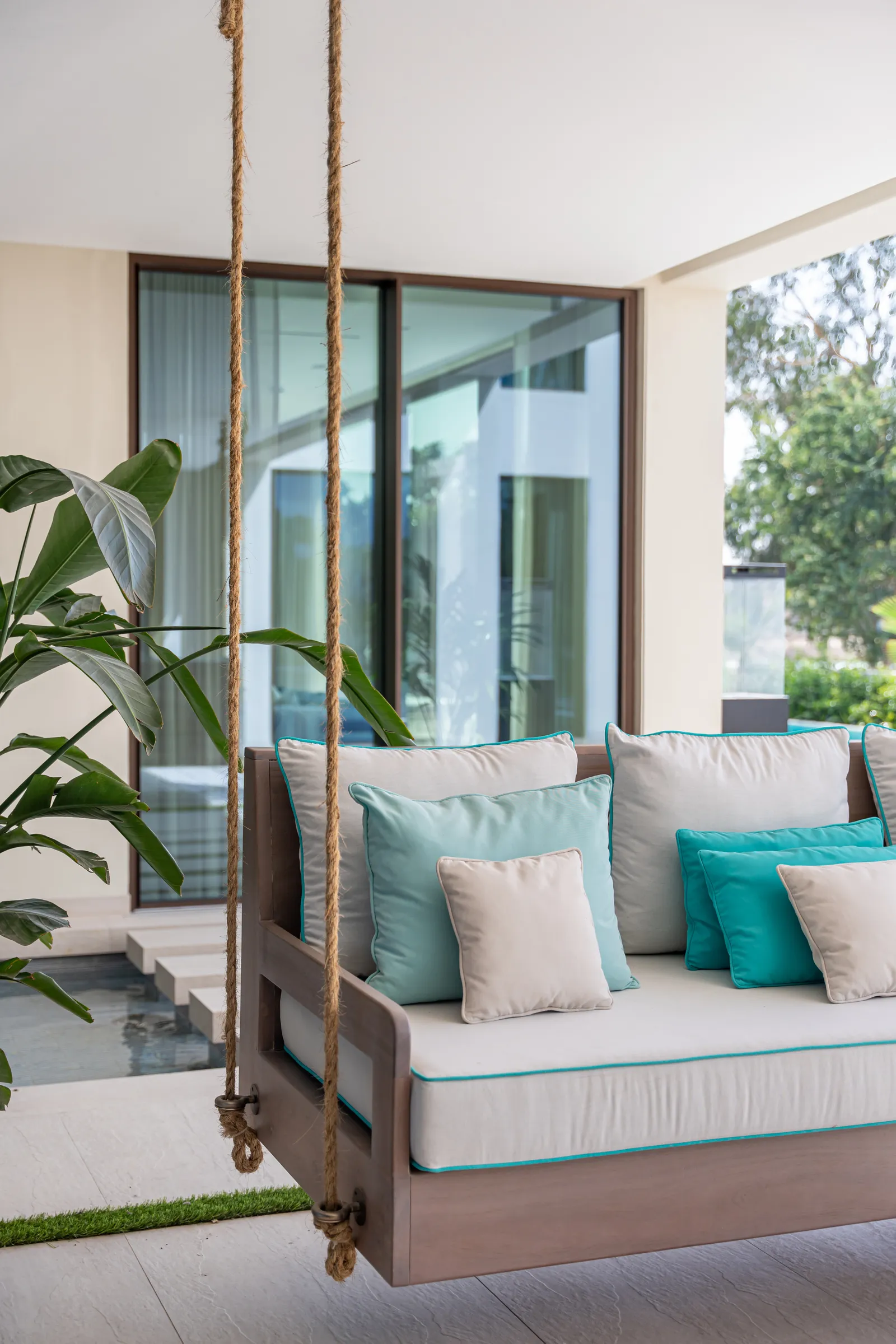 Cushioned lounge seating on the shaded terrace