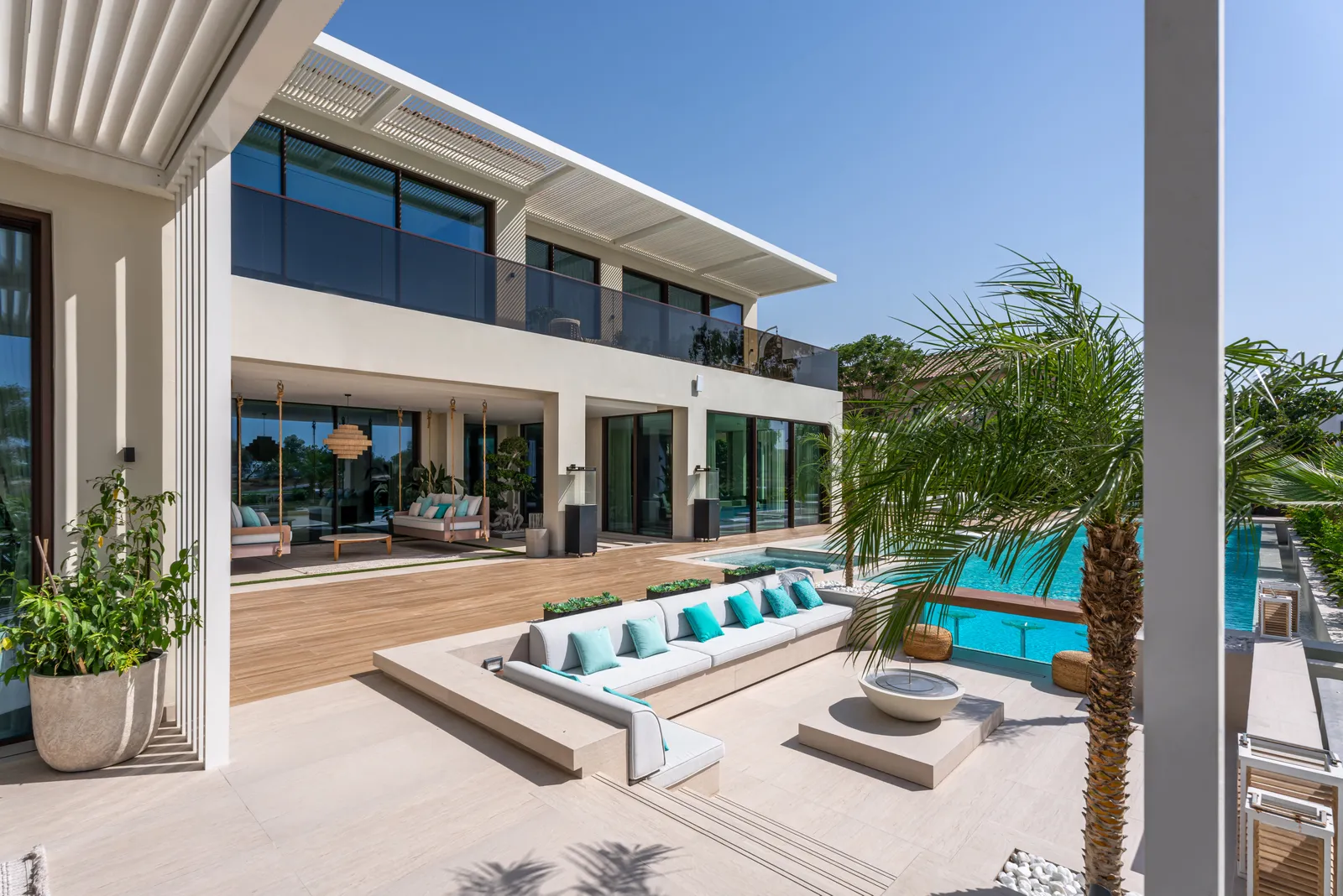 Villa terrace with loungers along the pool edge