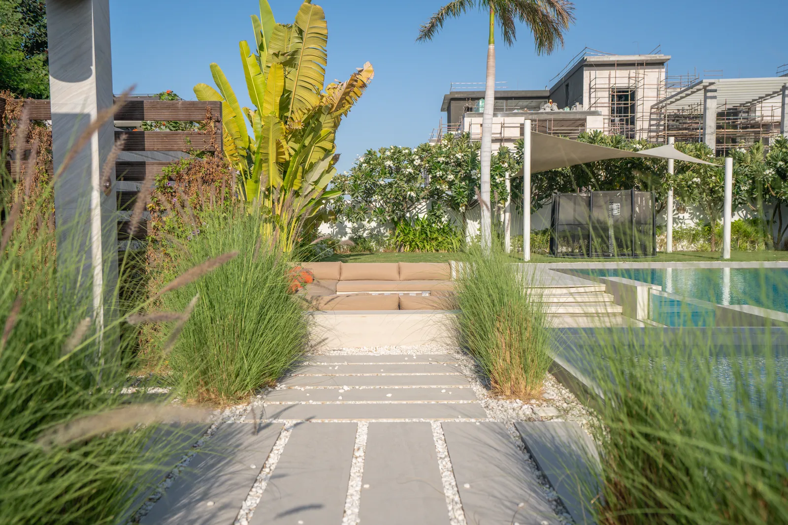 Stepping stones threading a bed of ornamental grass