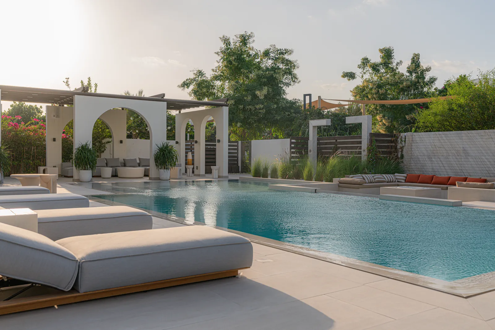 The pool running the length of the arched loggia