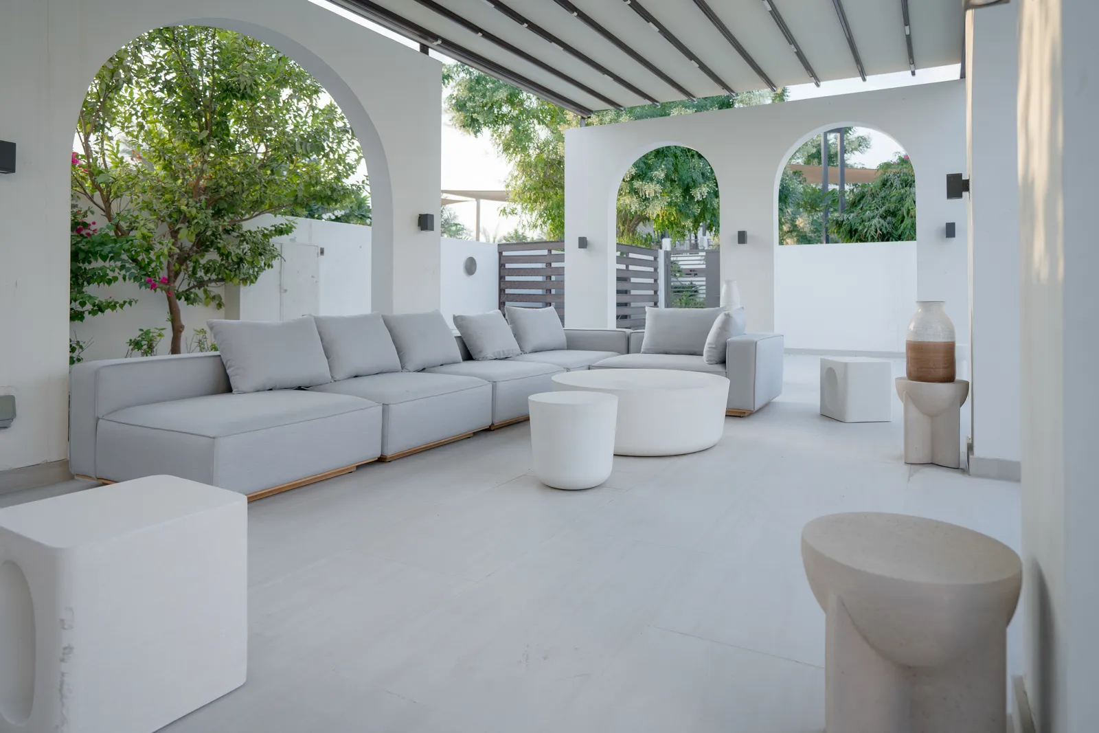 White seating under the arched loggia